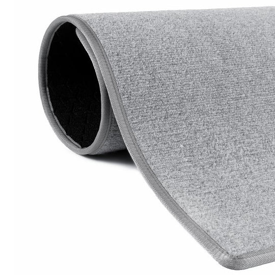 Ljusgrå dörr- och hallmatta.